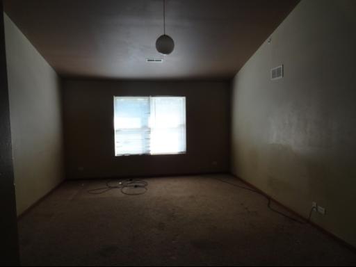21724 Carol Avenue Sauk Village, IL 60411 - Photo 7 of 10 an empty room with a window