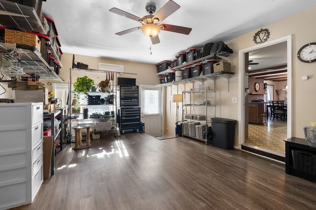 a view of a livingroom with furniture and a ceiling fan