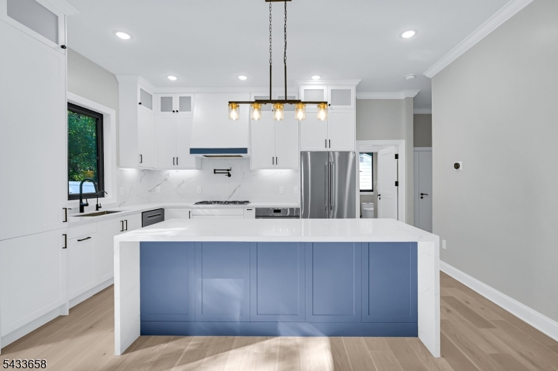 2 Orchard Road Florham Park, NJ 07932 - Photo 10 of 23 a large kitchen with kitchen island granite countertop a sink a stove and refrigerator