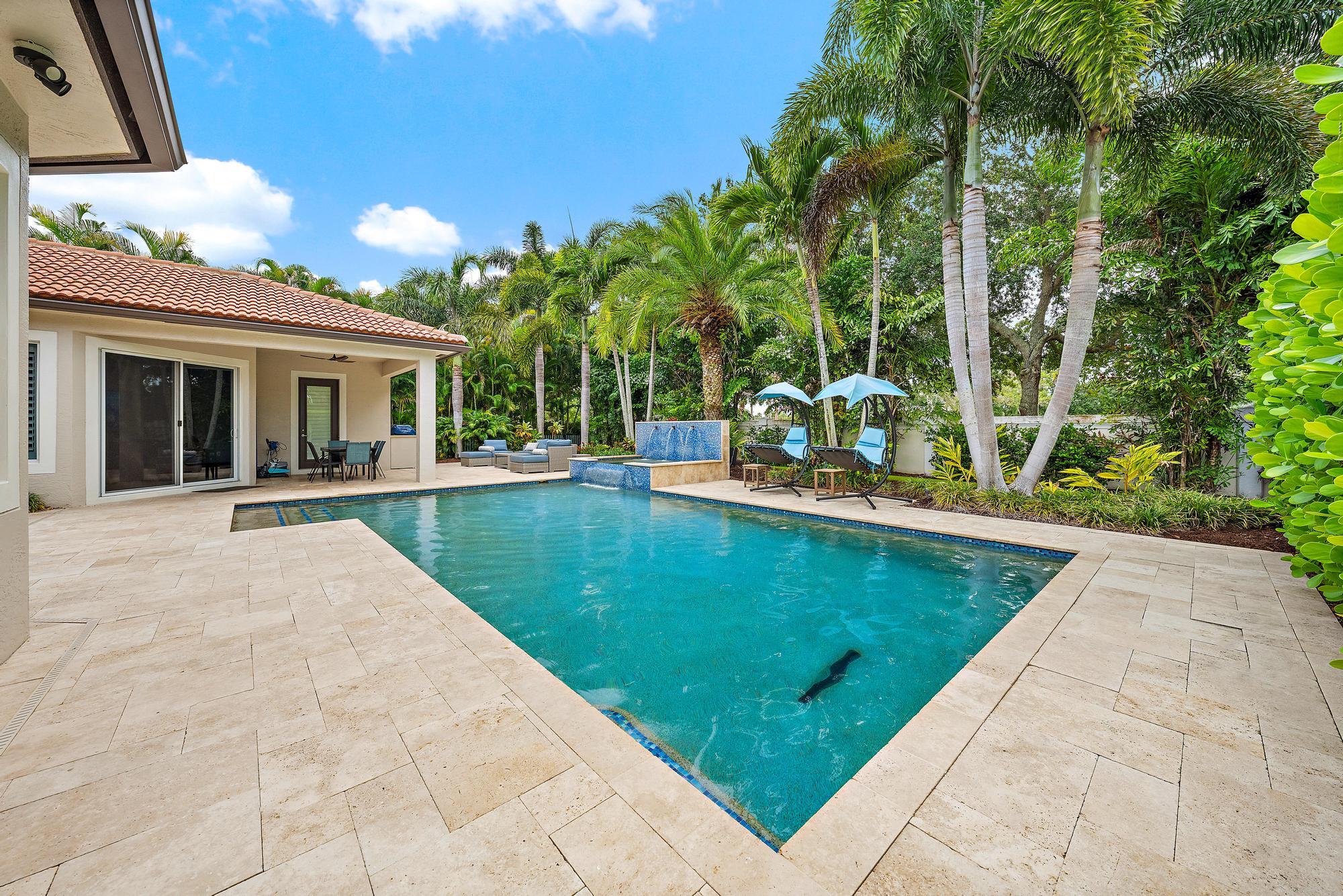 283 Rudder Cay Way Jupiter, FL 33458 - Photo 20 of 41 a view of a patio with swimming pool