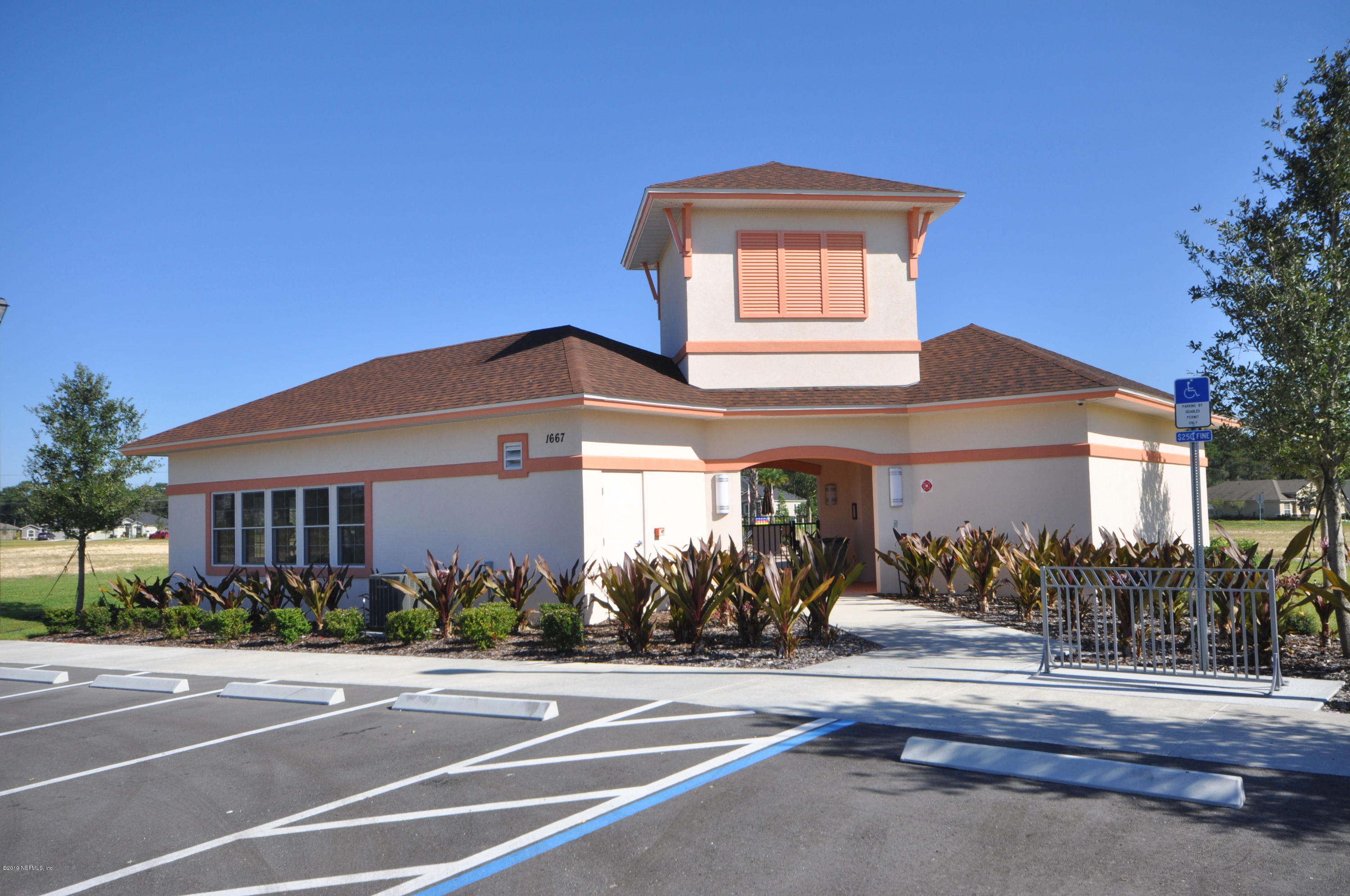 4292 Warm Springs Way Middleburg, FL 32068 - Photo 3 of 8 a front view of a house with a yard