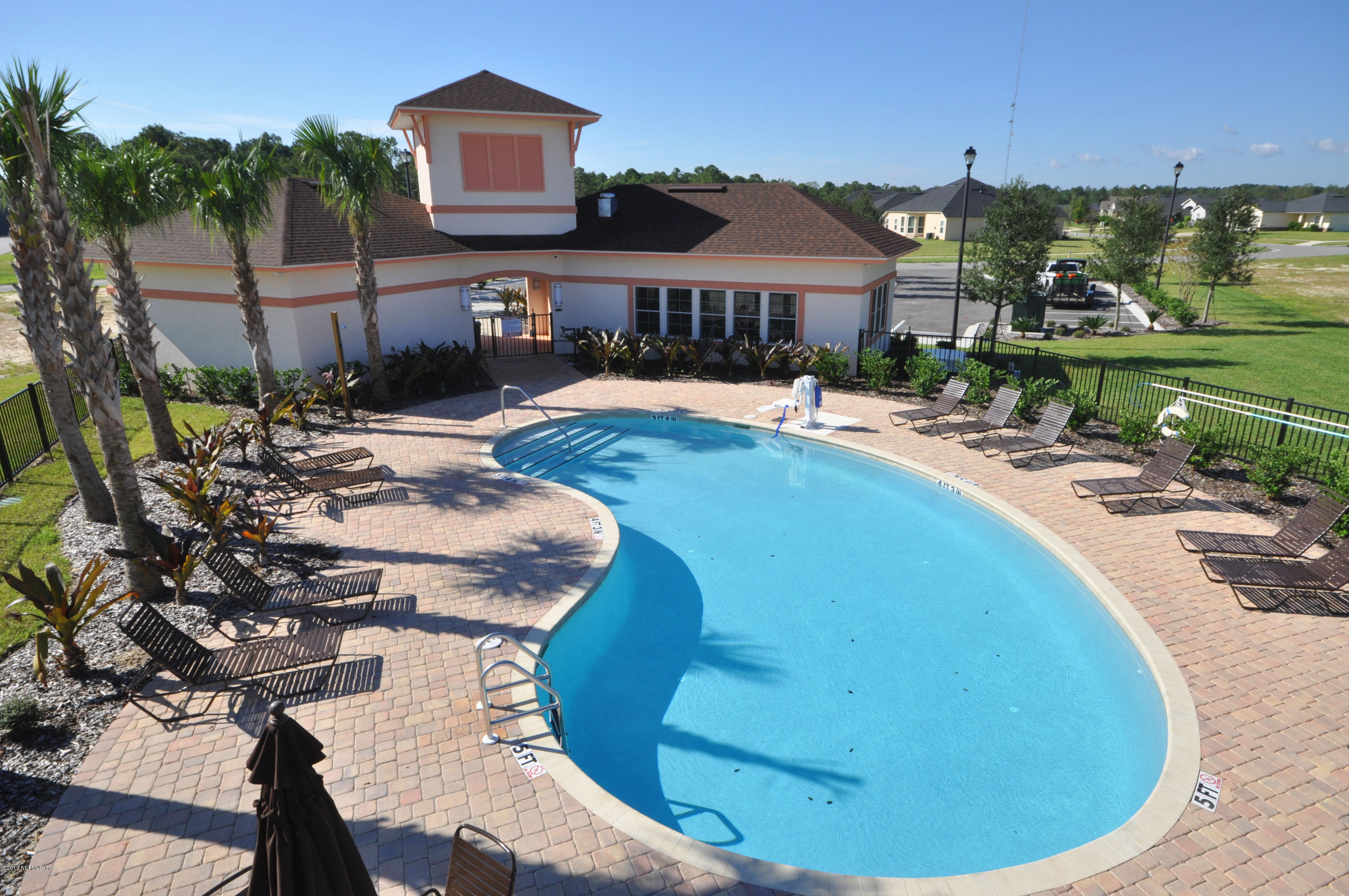 4292 Warm Springs Way Middleburg, FL 32068 - Photo 6 of 8 a view of a swimming pool with a patio