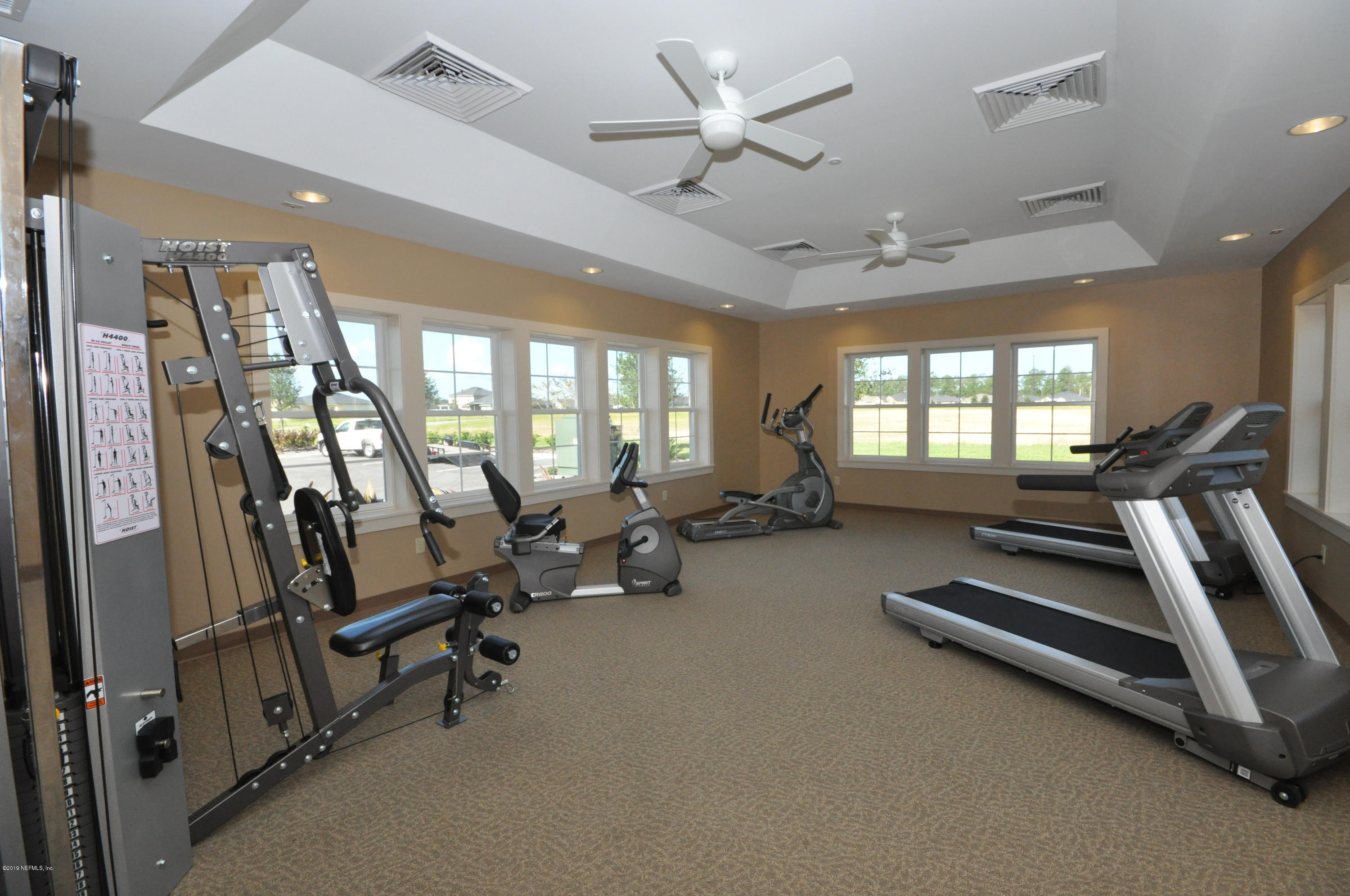 4292 Warm Springs Way Middleburg, FL 32068 - Photo 7 of 8 a view of a room with gym equipment