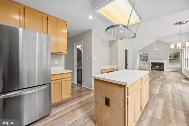 a view of a livingroom with wooden floor and a window