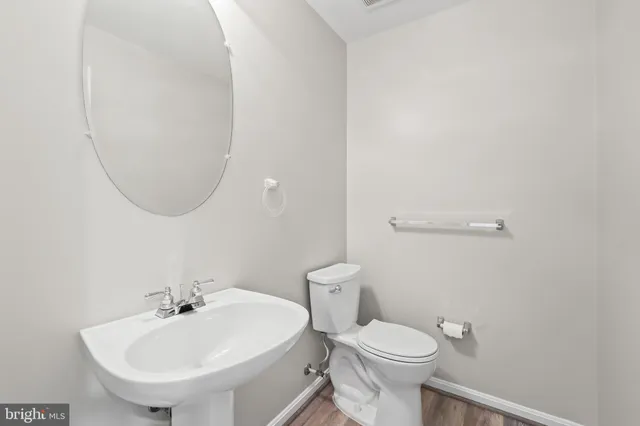 a view of an entryway with wooden floor