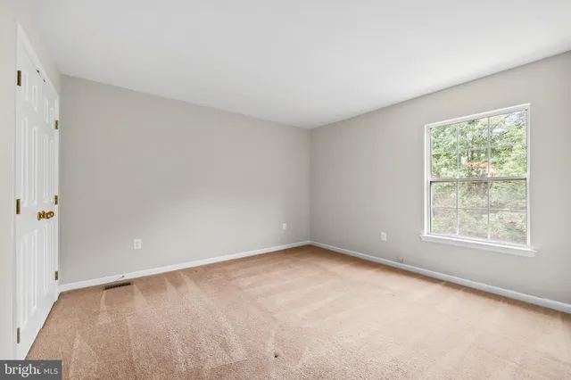 an empty room with a empty space and window