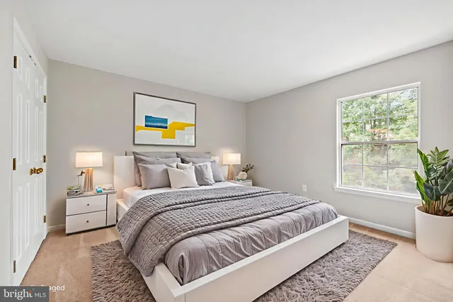 a bedroom with bed and a window