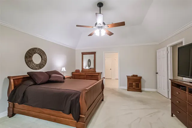 a bedroom with bed and a chandelier