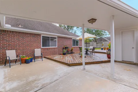 an outdoor space with patio the couches and pool table with chairs