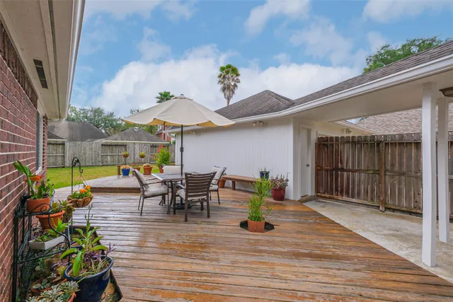 a view of a house with a garden and plants