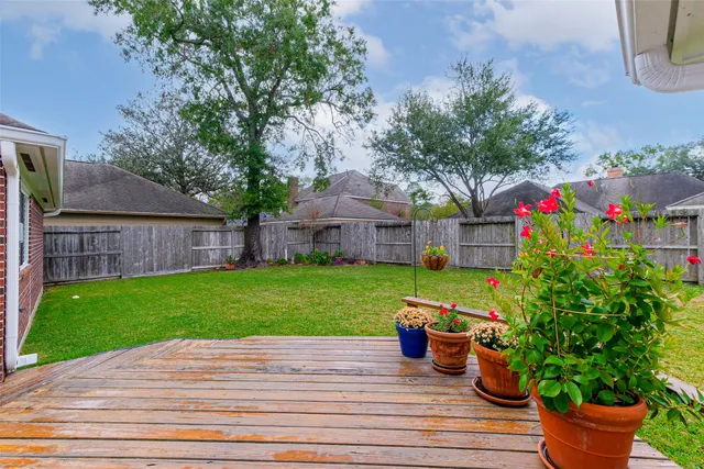 a view of house with backyard
