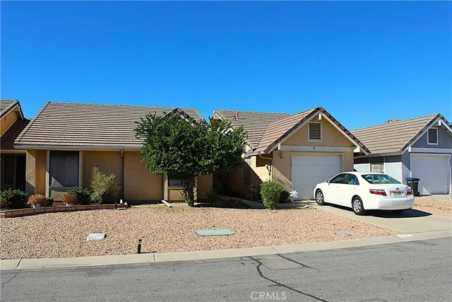 a car parked in front of white house