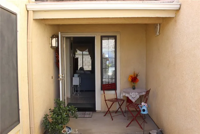 a view of a entryway door and dining room