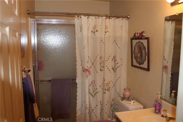 a bathroom with a shower curtain