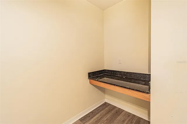 a kitchen with stainless steel appliances granite countertop a sink and a microwave
