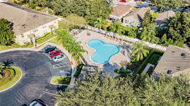 an aerial view of a house with a swimming pool