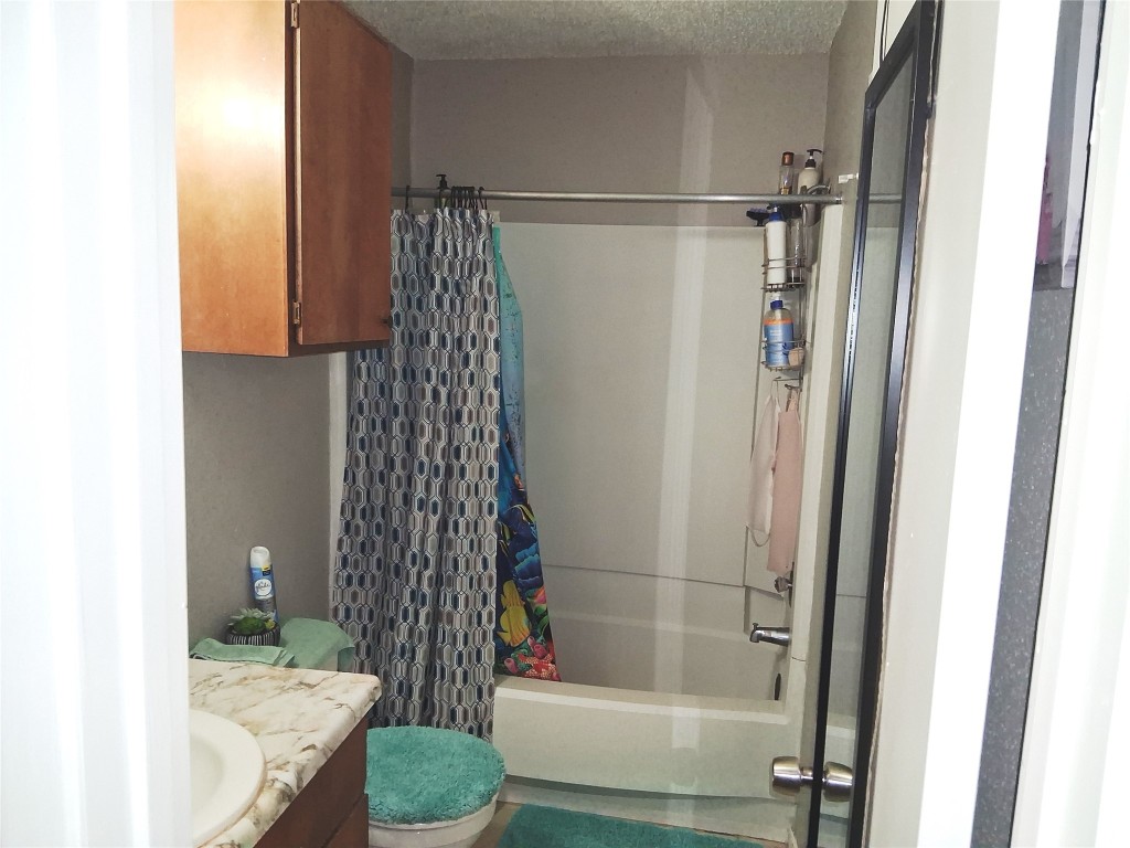 23347 Pebworth Place Spring, TX 77373 - Photo 7 of 10 Cozy bathroom with ample storage, sleek fixtures, and a charming shower-tub combo.
