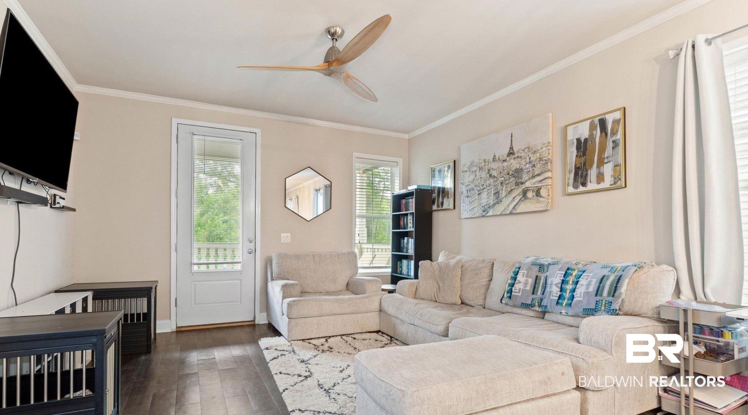 25806 Pollard Road, Unit 203 Daphne, AL 36526 - Photo 2 of 14 Living room with a ceiling fan, dark wood finished floors, and crown molding