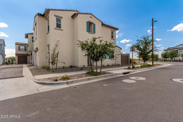 a view of a house with a street