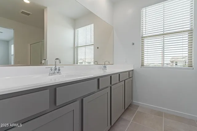 a bathroom with a sink and a window