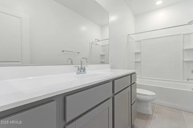 a bathroom with a sink a toilet a shower and a mirror