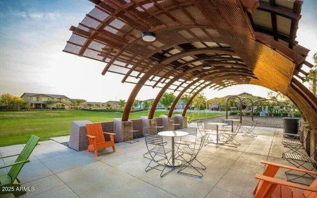 a view of a chairs and table in the patio