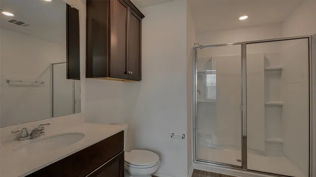 a view of an empty room with a kitchen