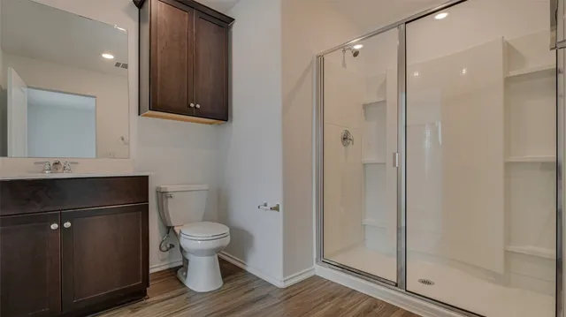 a view of a small space with a window and a fan