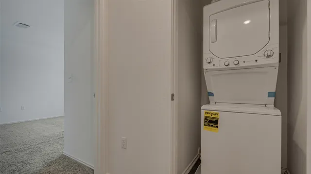 a view of an empty room and a window