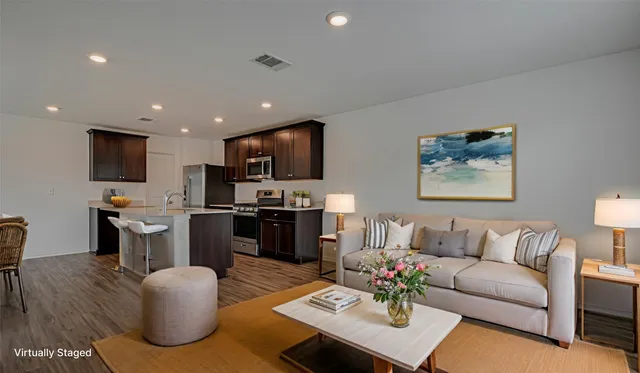 a view of kitchen with microwave oven stove and oven