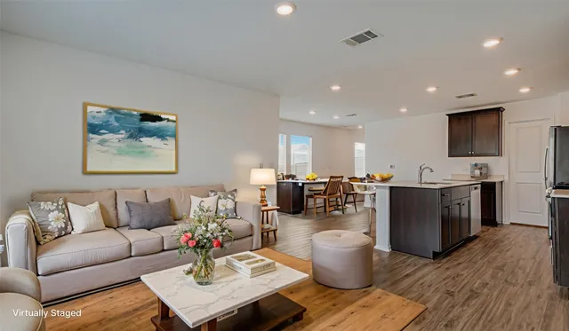 a living room with fireplace furniture and a flat screen tv