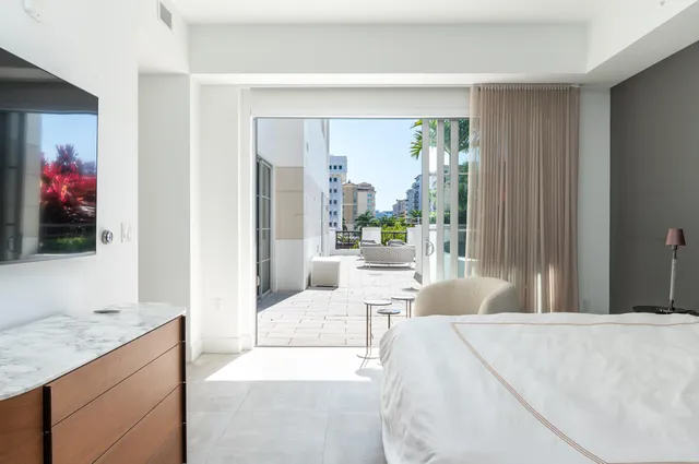 a bathroom with double vanity sinks and a mirror