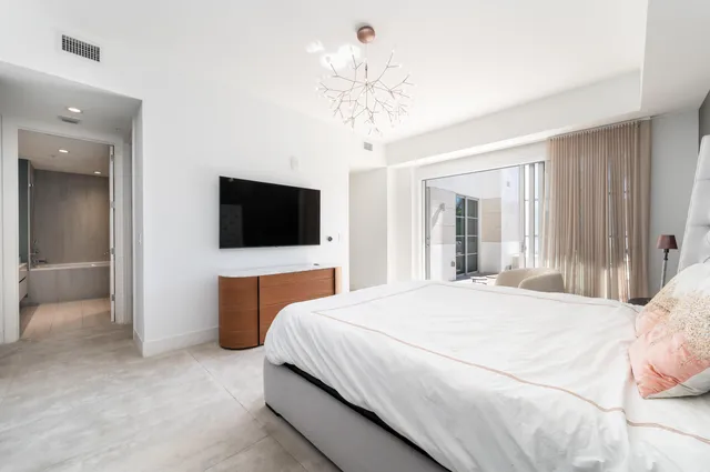 a bathroom with a shower a toilet and a sink