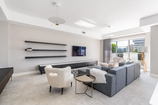 a living room with furniture and a window