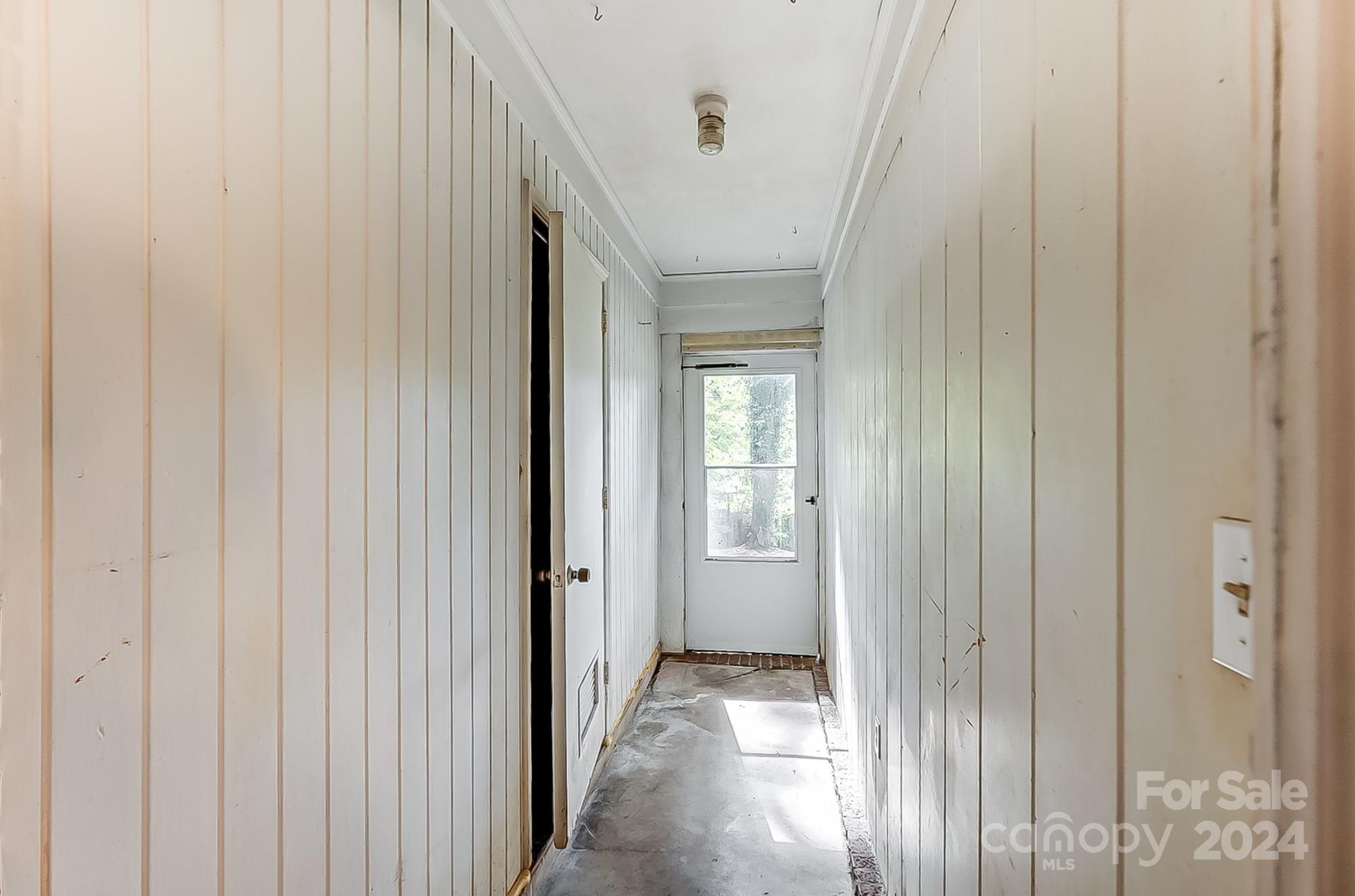 3218 Valley Grove Road Charlotte, NC 28227 - Photo 20 of 23 a view of a hallway with a wooden door