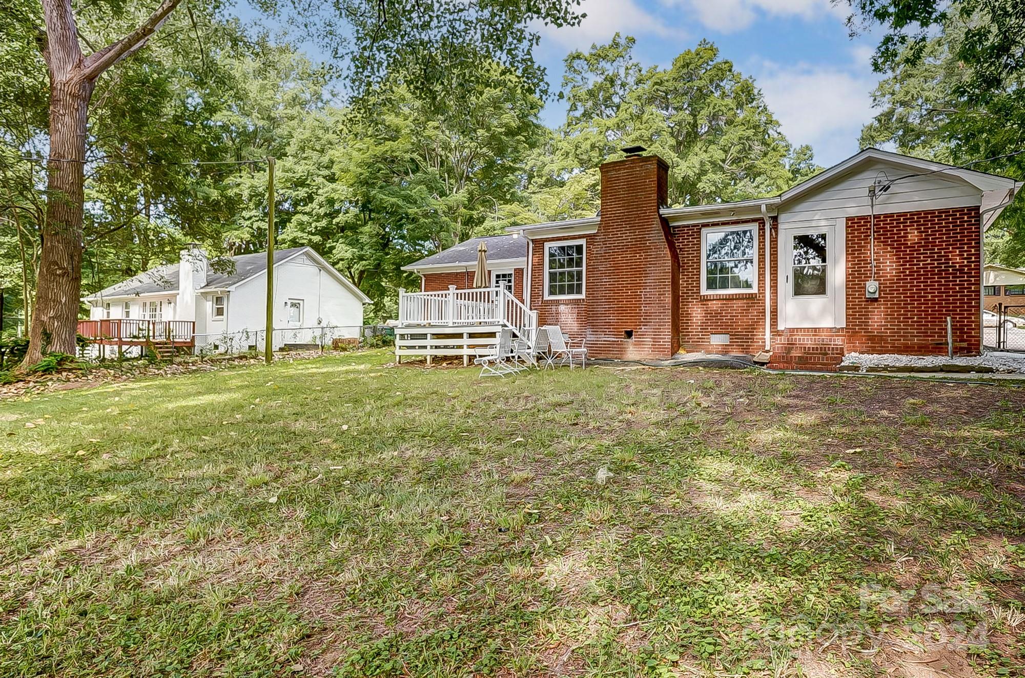 3218 Valley Grove Road Charlotte, NC 28227 - Photo 21 of 23 a front view of house with yard and trees around
