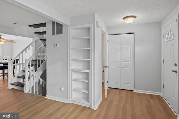 a view of entryway with wooden floor