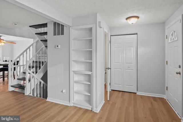 a view of entryway with wooden floor