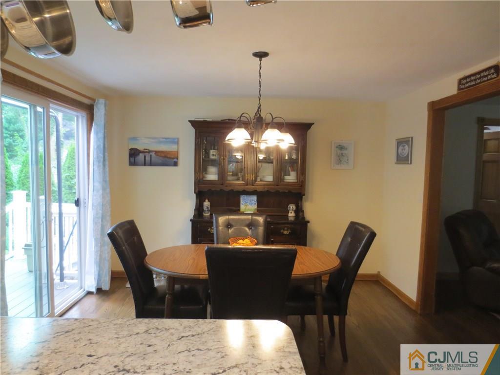 235 Maple Avenue Dunellen, NJ 08812 - Photo 14 of 20 a view of a dining room with furniture window and outside view