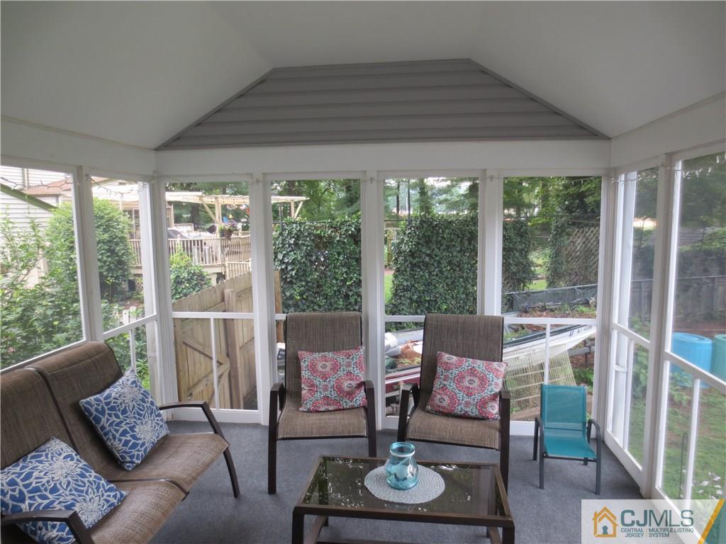 235 Maple Avenue Dunellen, NJ 08812 - Photo 3 of 20 a living room with furniture and a floor to ceiling window