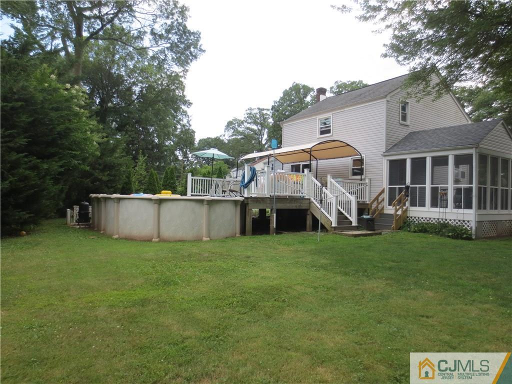 235 Maple Avenue Dunellen, NJ 08812 - Photo 5 of 20 a front view of a house with garden