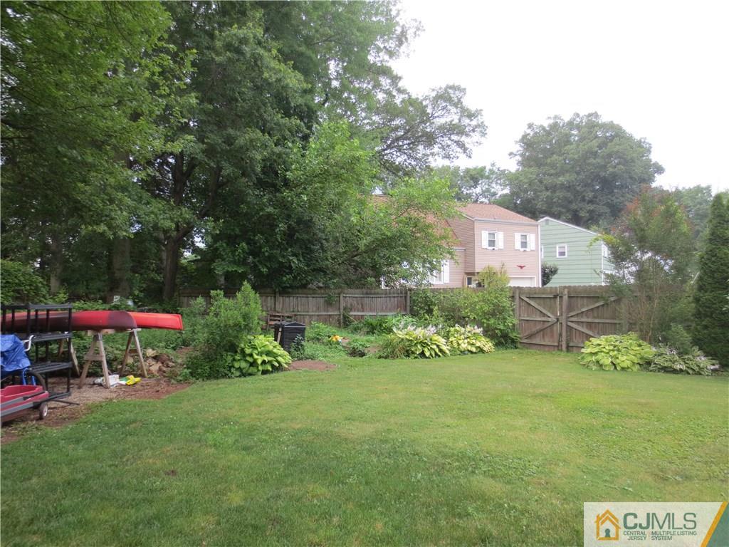 235 Maple Avenue Dunellen, NJ 08812 - Photo 7 of 20 a view of a house with a yard porch and sitting area