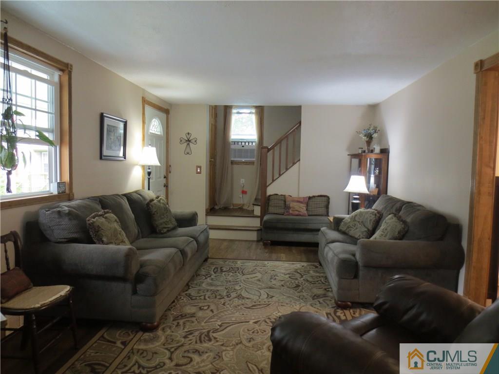 235 Maple Avenue Dunellen, NJ 08812 - Photo 10 of 20 a living room with furniture and a couch