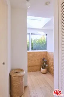 a bathroom with a sink a mirror and a shower