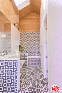 a bathroom with a bathtub and shower