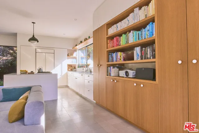 front view of a house with potted plants
