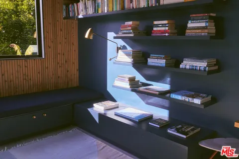 front view of a house with potted plants