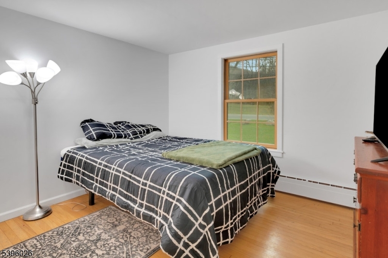 4435 Rudetown Road Hamburg, NJ 07419 - Photo 15 of 24 a bedroom with a bed and a window