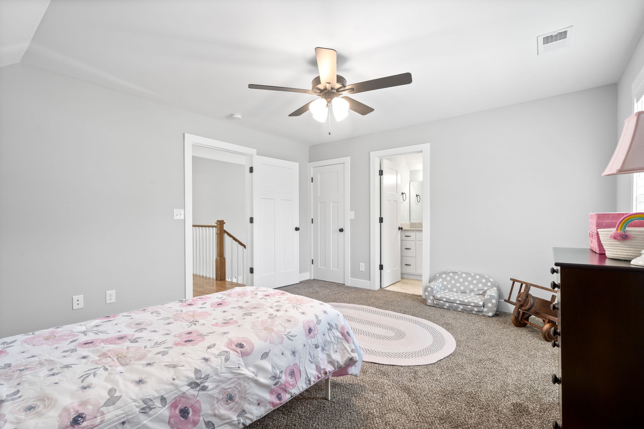 3744 McGregor Road Adams, TN 37010 - Photo 26 of 48 a bedroom with a bed and a chandelier