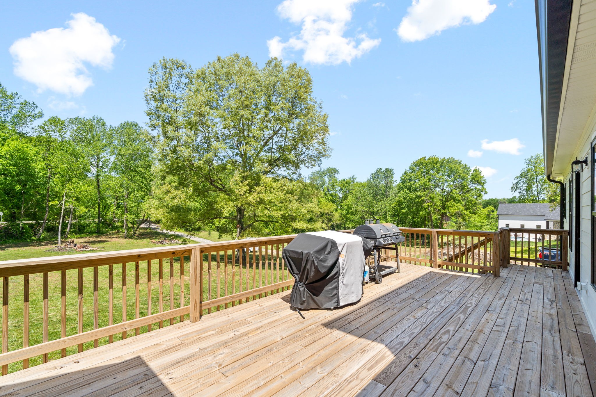 3744 McGregor Road Adams, TN 37010 - Photo 38 of 48 a view of a deck with two chair and wooden floor